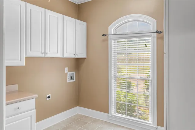a view of a livingroom with furniture window and wooden floor