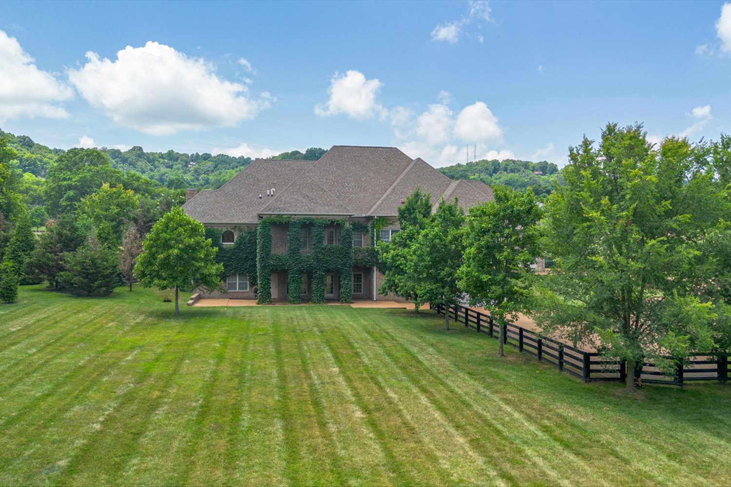 1400 Franklin Road Brentwood, TN 37027 - Photo 5 of 67 a view of a house with a yard and sitting area