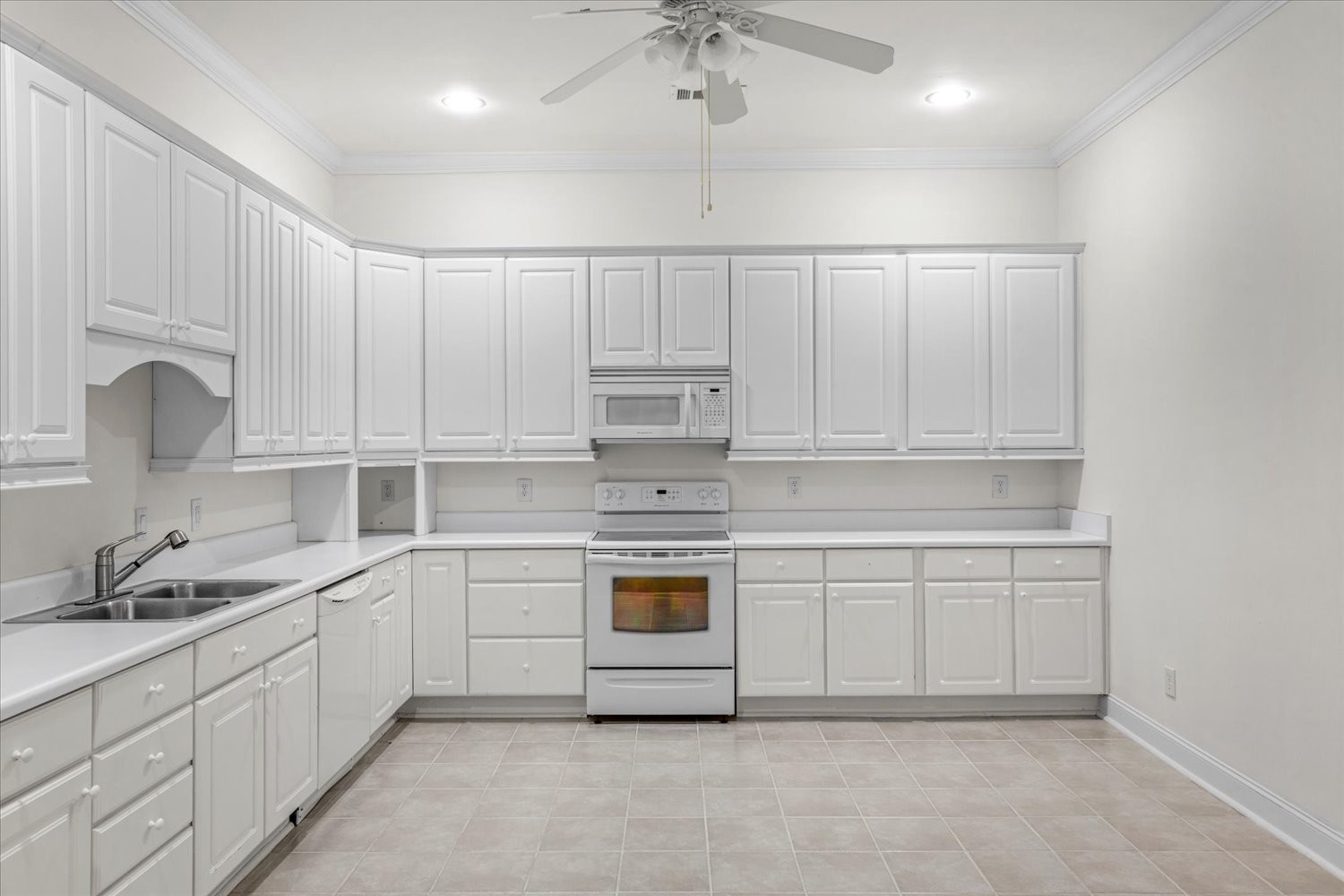 1400 Franklin Road Brentwood, TN 37027 - Photo 53 of 67 a kitchen with white cabinets and white appliances
