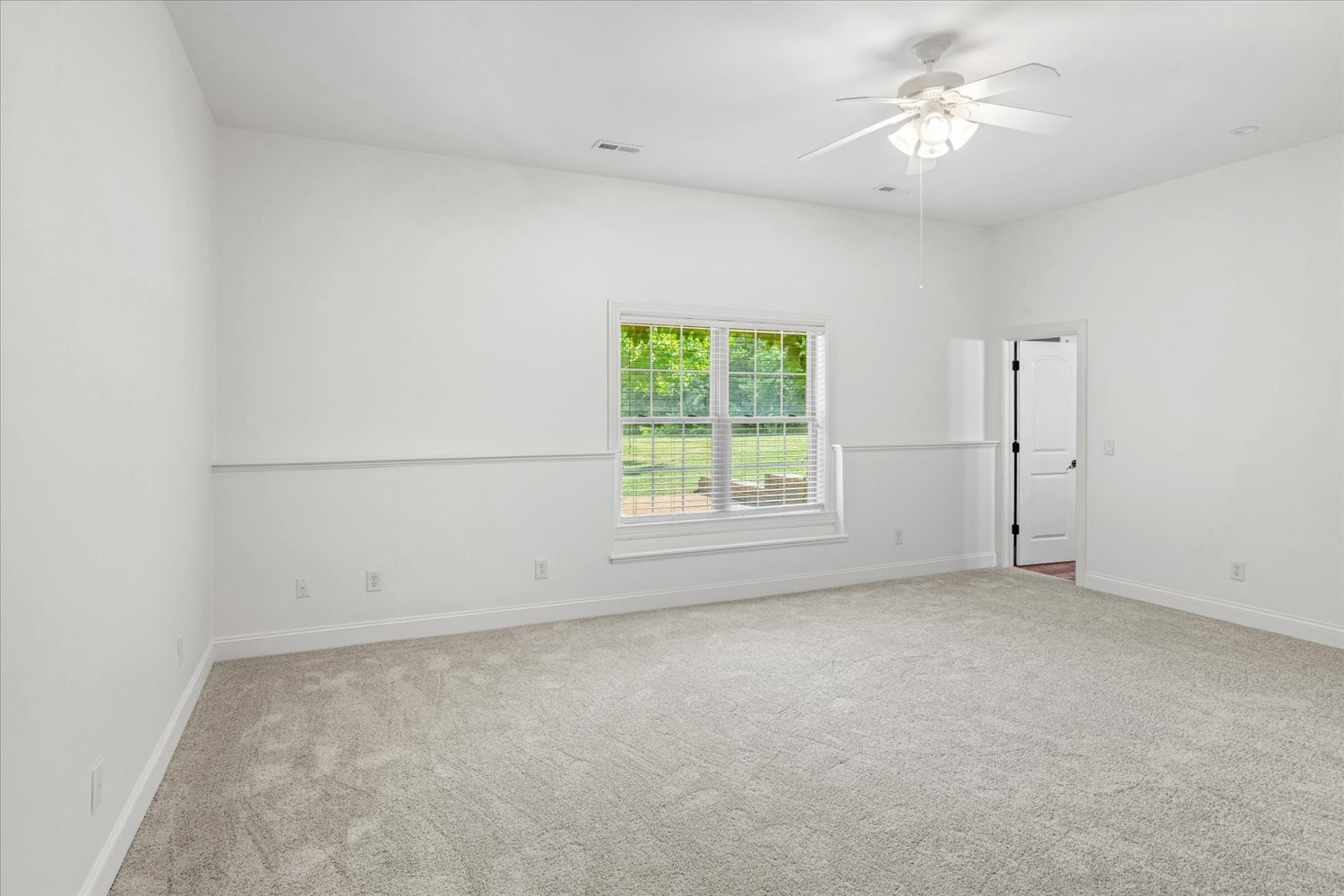 1400 Franklin Road Brentwood, TN 37027 - Photo 56 of 67 an empty room with a window and a ceiling fan