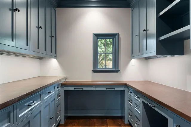 a kitchen with granite countertop a sink and a stove