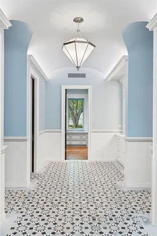 a bathroom with a window a a bathtub and a shower