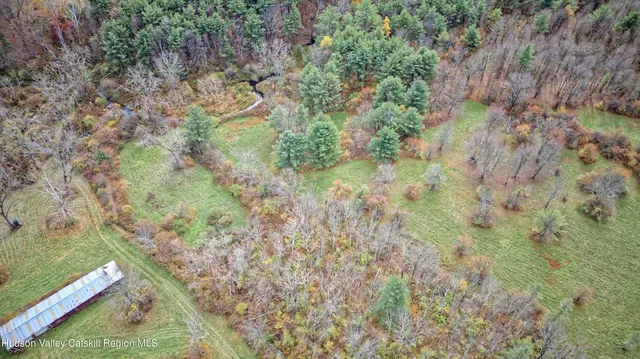 a view of a yard with an outdoor seating