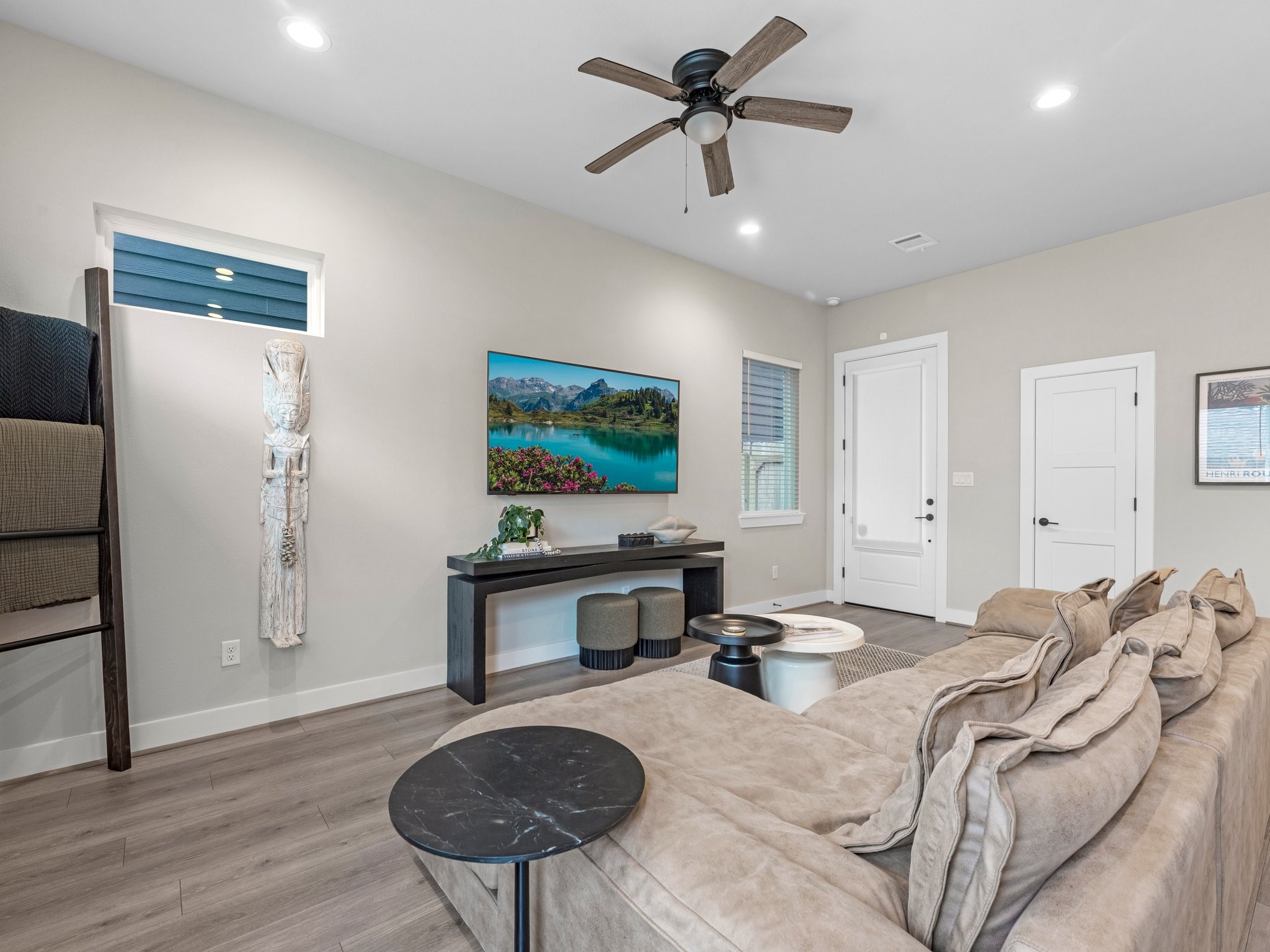 307 Charlock Street Houston, TX 77022 - Photo 13 of 18 a living room with furniture and a flat screen tv