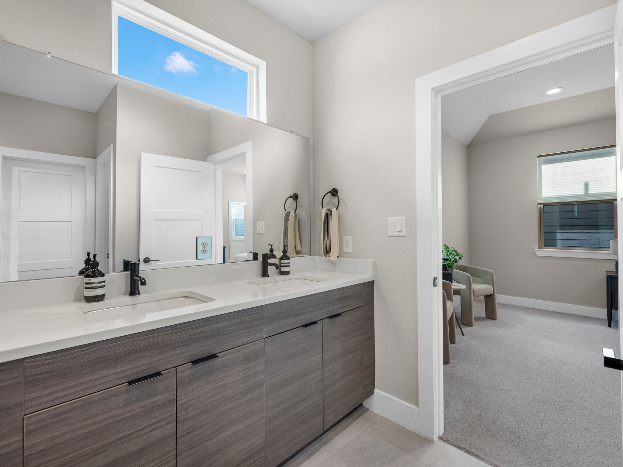 307 Charlock Street Houston, TX 77022 - Photo 14 of 18 a bathroom with a double vanity sink and a mirror