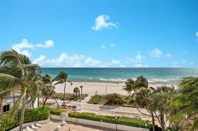 a view of a lake with a big yard