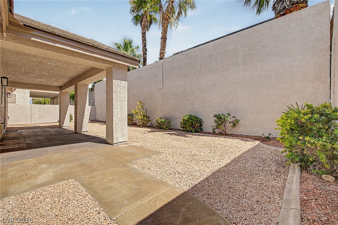 835 Entrada Ridge Avenue Henderson, NV 89012 - Photo 31 of 34 A convenient covered parking space offers protection for vehicles and easy access to the residence.