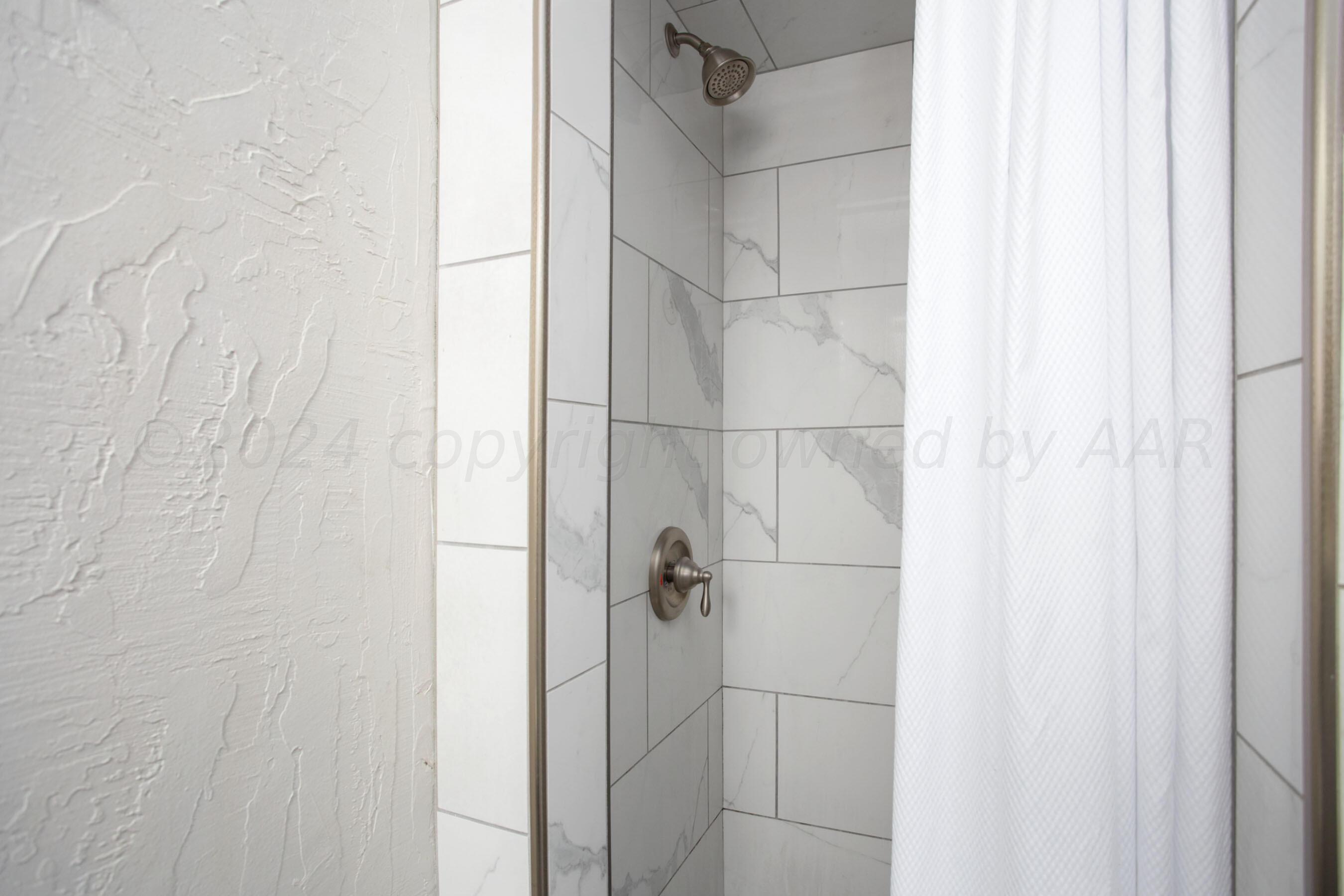 8122 Santa Fe Trail Amarillo, TX 79110 - Photo 18 of 23 a bathroom with a shower