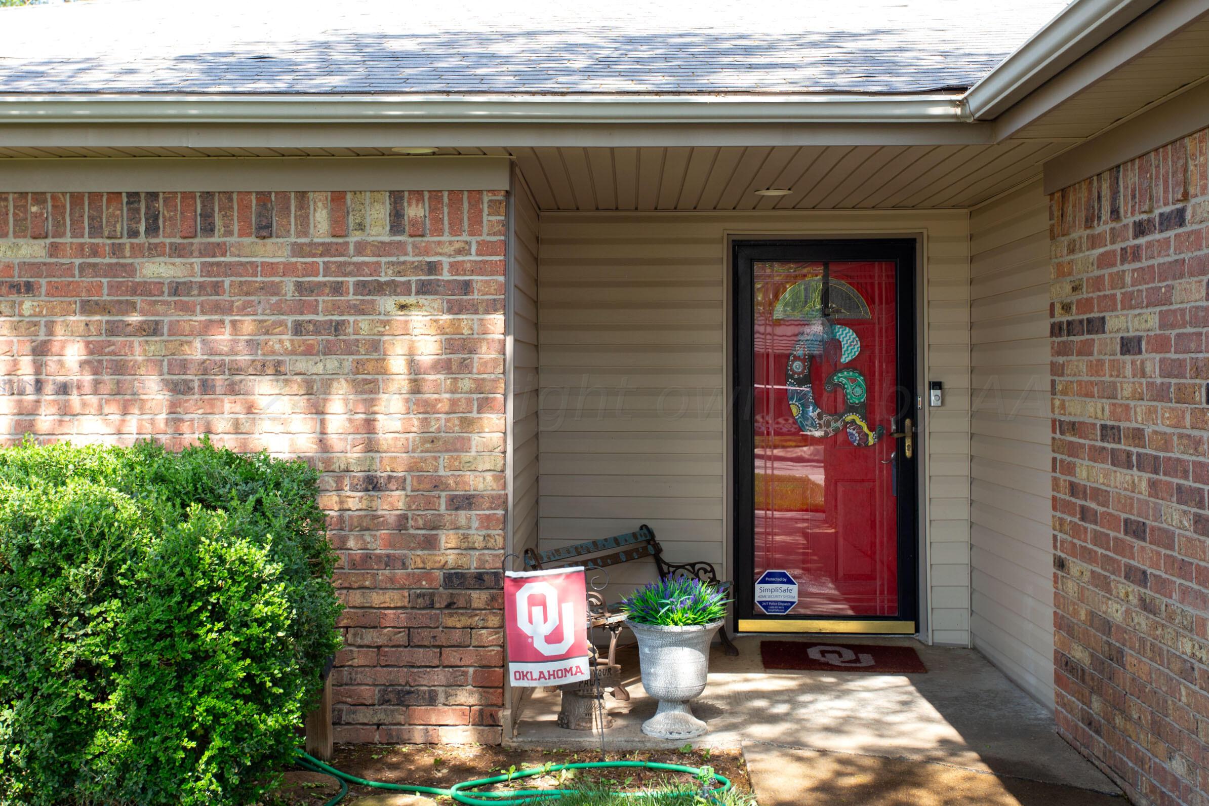 8122 Santa Fe Trail Amarillo, TX 79110 - Photo 2 of 23 a front view of a house with plants