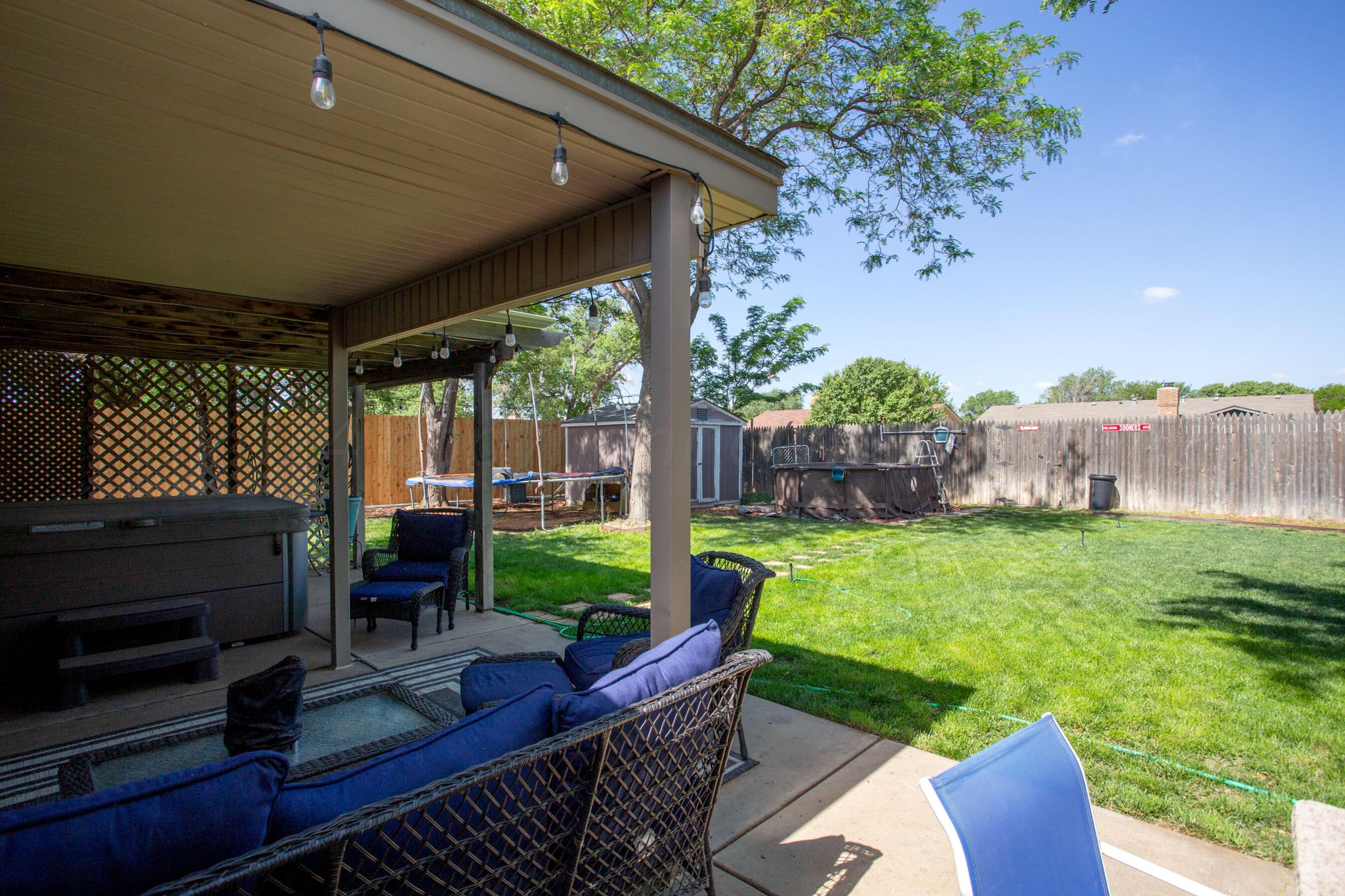 8122 Santa Fe Trail Amarillo, TX 79110 - Photo 23 of 23 a view of a porch with furniture and a yard
