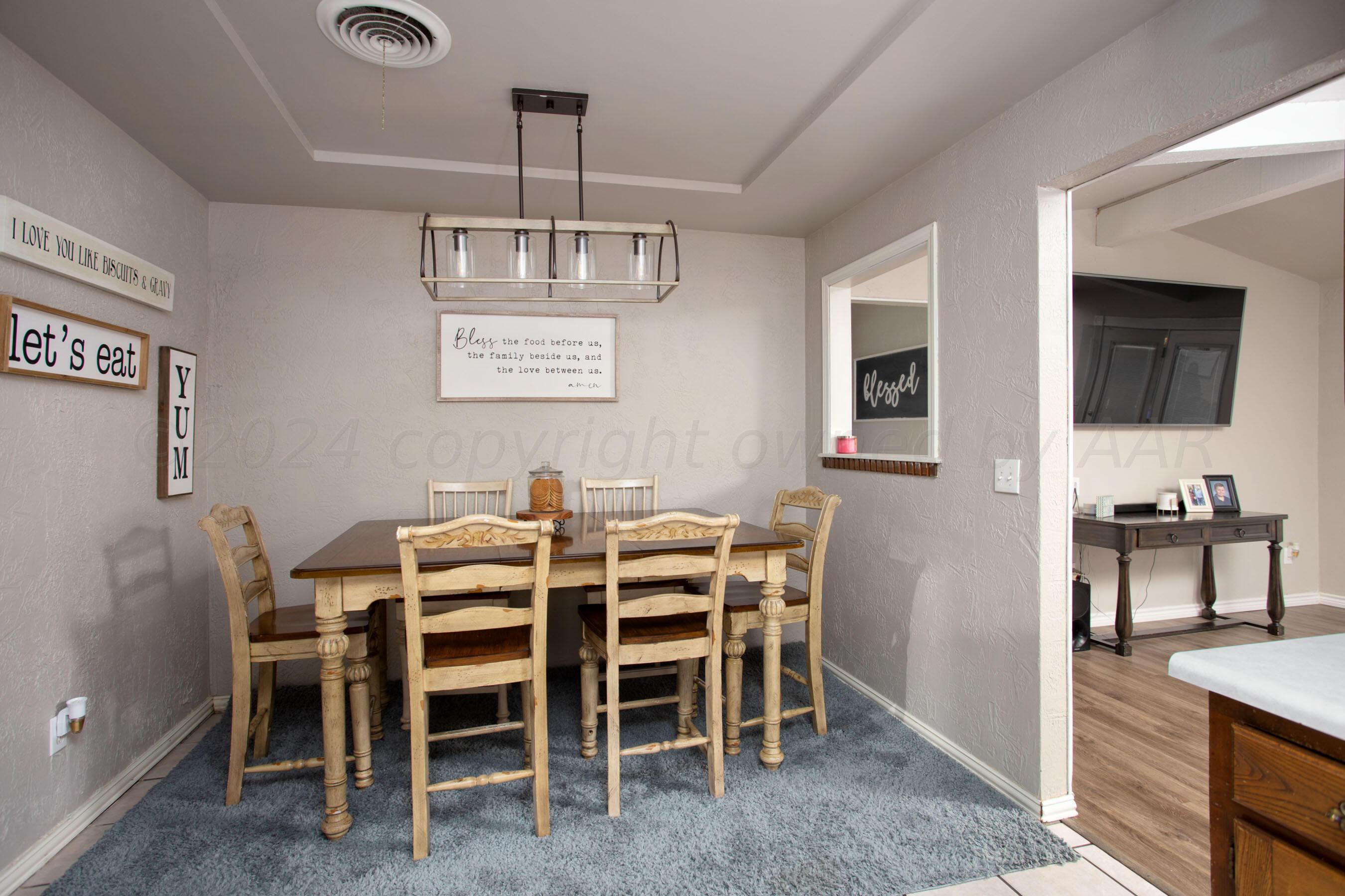 8122 Santa Fe Trail Amarillo, TX 79110 - Photo 8 of 23 a view of a dining room with furniture