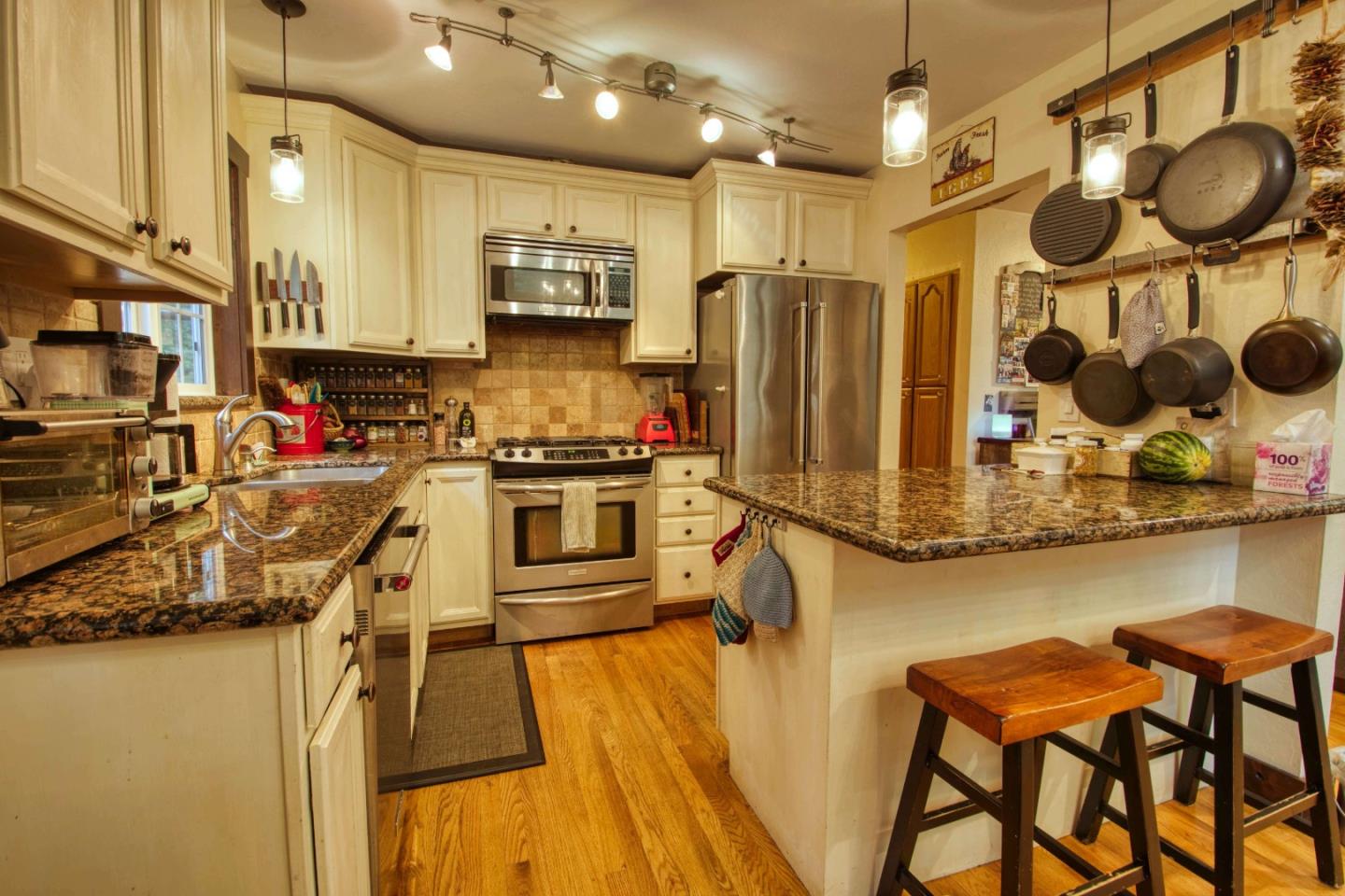 Long Ridge Road Los Gatos, CA 95033 - Photo 13 of 30 a kitchen with stainless steel appliances granite countertop sink stove refrigerator and cabinets