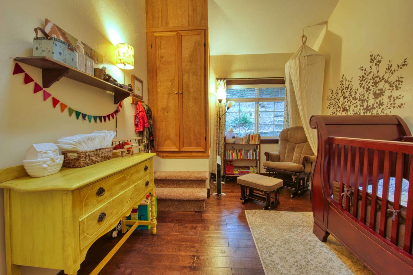 Long Ridge Road Los Gatos, CA 95033 - Photo 22 of 30 a bedroom with a bed and wooden floor