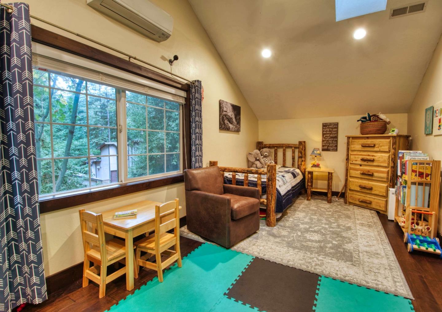 Long Ridge Road Los Gatos, CA 95033 - Photo 23 of 30 a living room with furniture and a flat screen tv