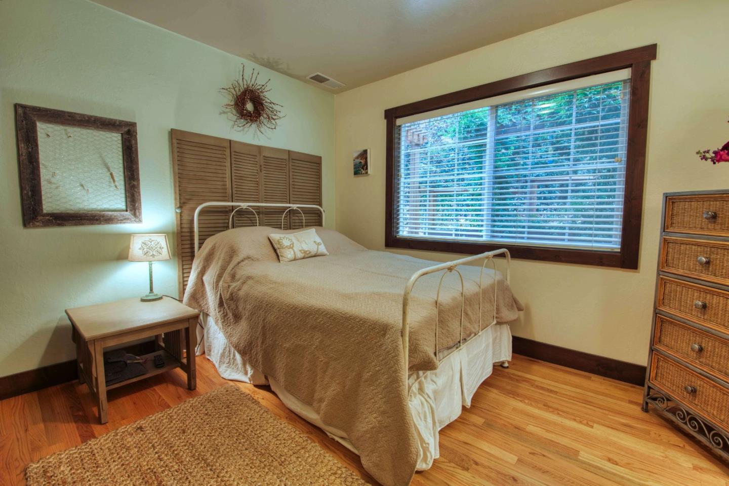 Long Ridge Road Los Gatos, CA 95033 - Photo 28 of 30 a bedroom with a bed a dresser and chair