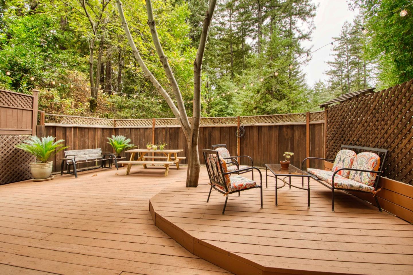 Long Ridge Road Los Gatos, CA 95033 - Photo 7 of 30 a view of a patio with dining table and chairs with wooden floor and fence