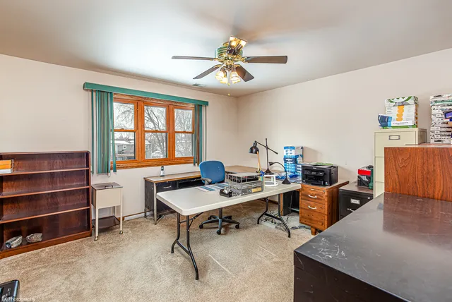 a workspace with furniture and window