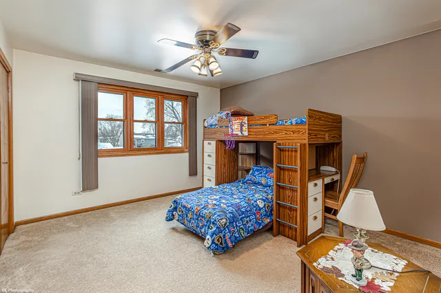 a bed room with a bed and a chandelier