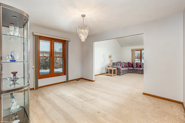 a view of a livingroom with dishwasher and furniture