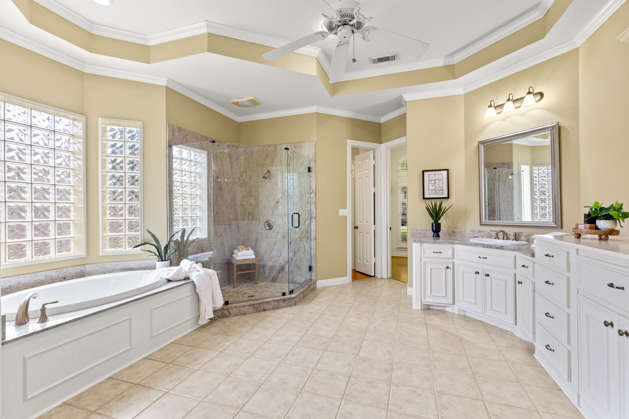 6610 Radley Drive Spring, TX 77379 - Photo 23 of 50 Super spacious updated primary bathroom w/ tray high ceilings to match bedroom.