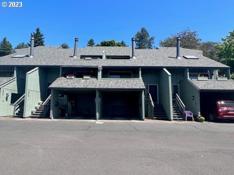 941 Prescott Lane Springfield, OR 97477 - Photo 1 of 15 a view of a house with large space and a car park in front of it