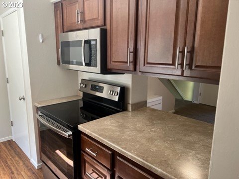941 Prescott Lane Springfield, OR 97477 - Photo 7 of 15 a kitchen with stainless steel appliances granite countertop a stove and a microwave