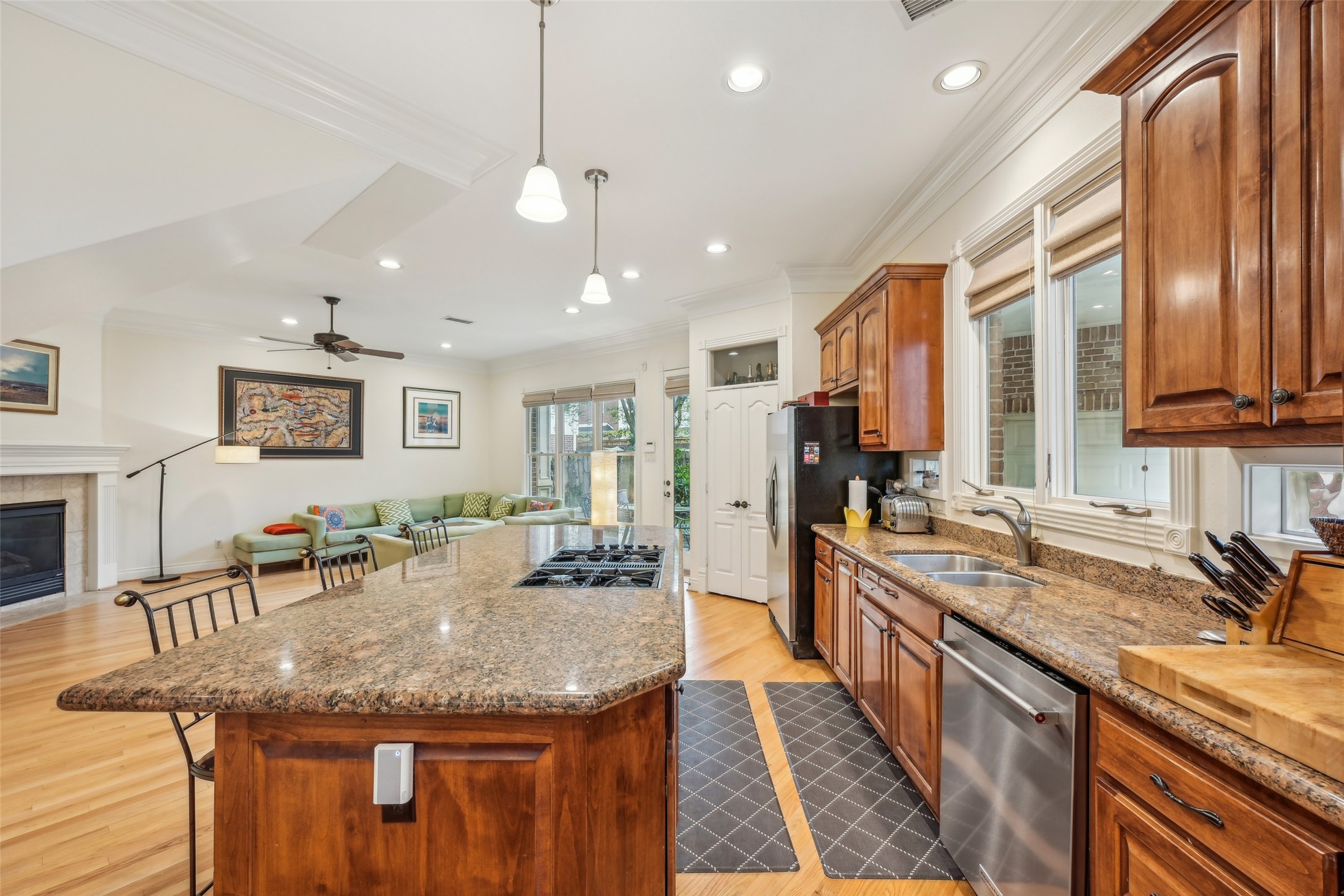 4026 Villanova Street Houston, TX 77005 - Photo 11 of 48 a kitchen with stainless steel appliances granite countertop a sink and stove