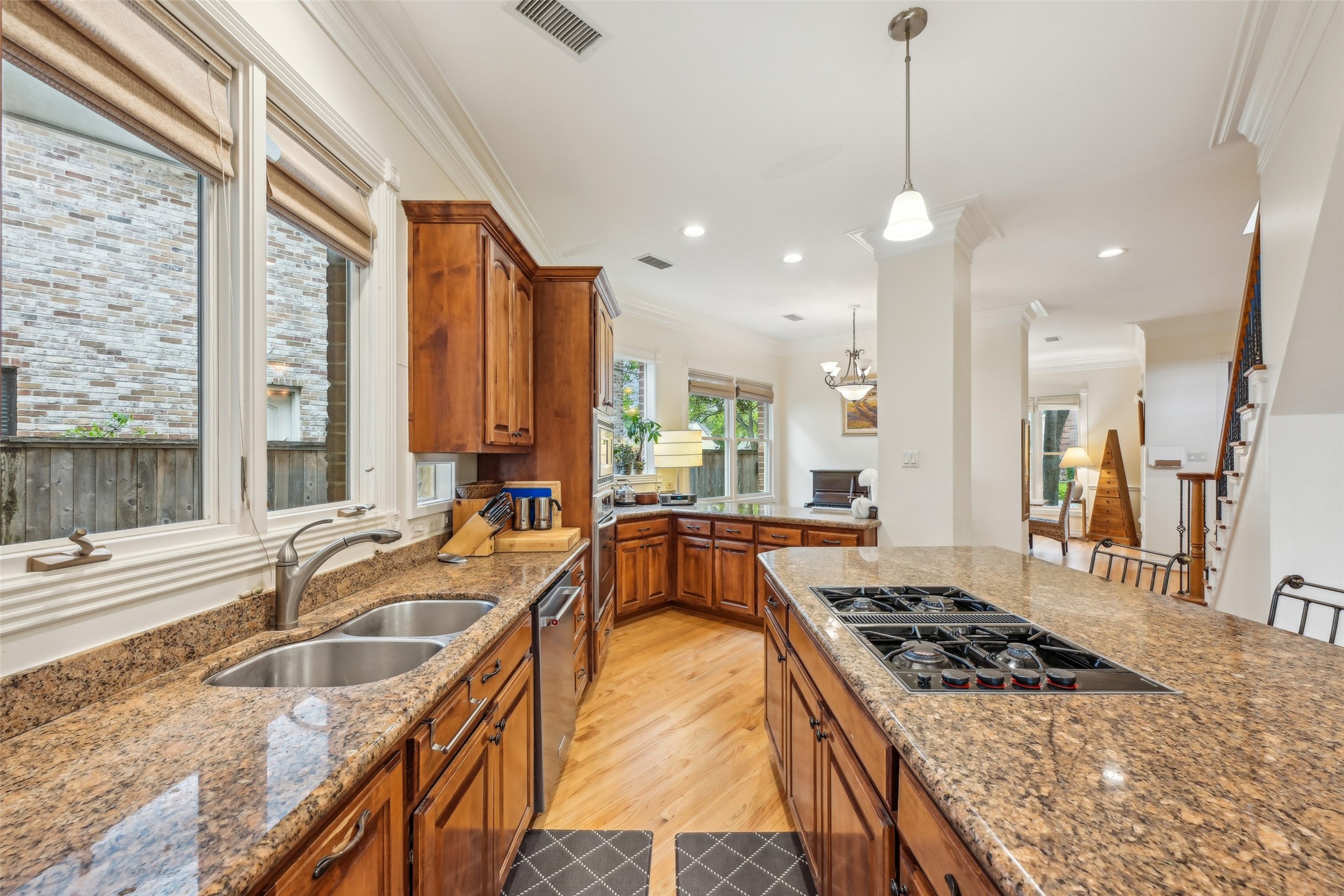 4026 Villanova Street Houston, TX 77005 - Photo 12 of 48 a kitchen with stainless steel appliances granite countertop a sink stove and cabinets