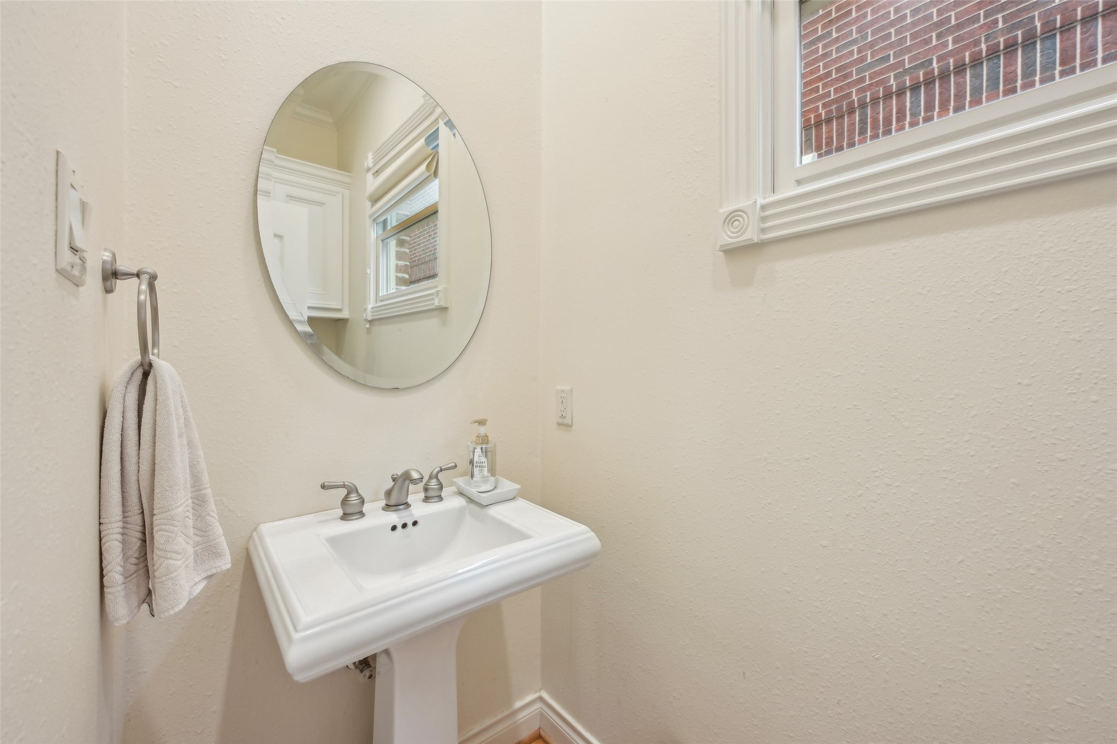 4026 Villanova Street Houston, TX 77005 - Photo 17 of 48 a bathroom with a sink and a mirror