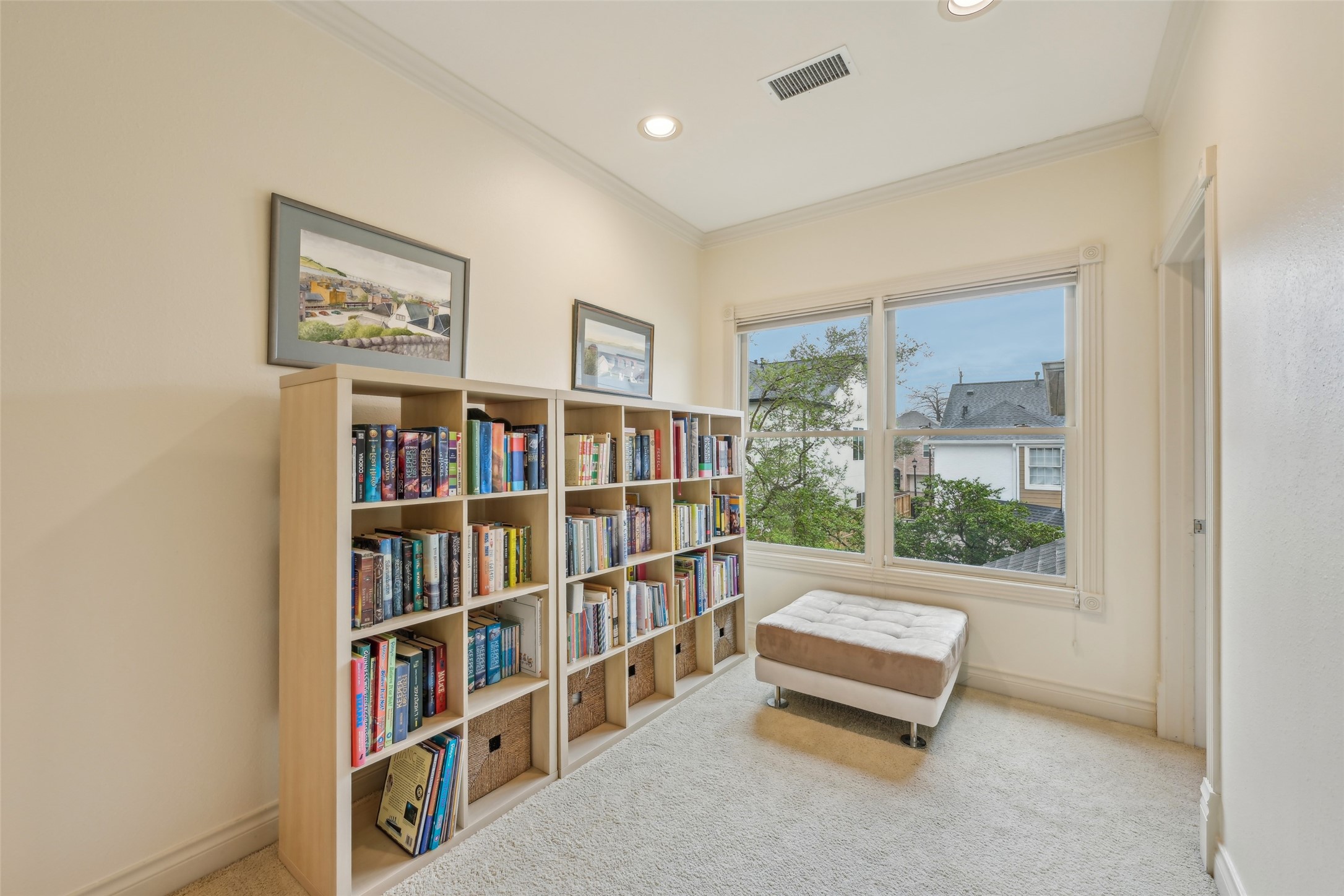 4026 Villanova Street Houston, TX 77005 - Photo 19 of 48 a living room with couch a book shelf and a window
