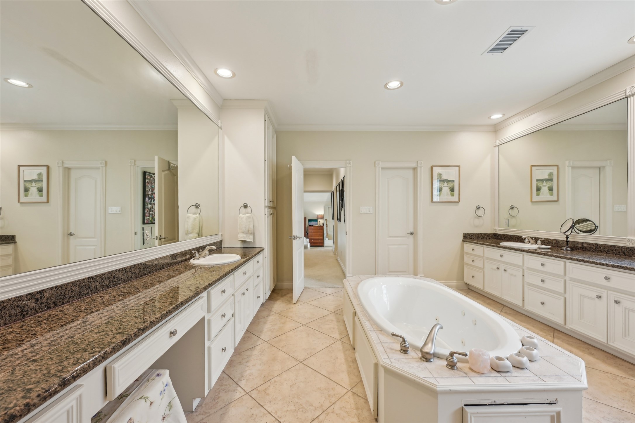 4026 Villanova Street Houston, TX 77005 - Photo 24 of 48 a spacious bathroom with a granite countertop tub double vanity sink and a mirror