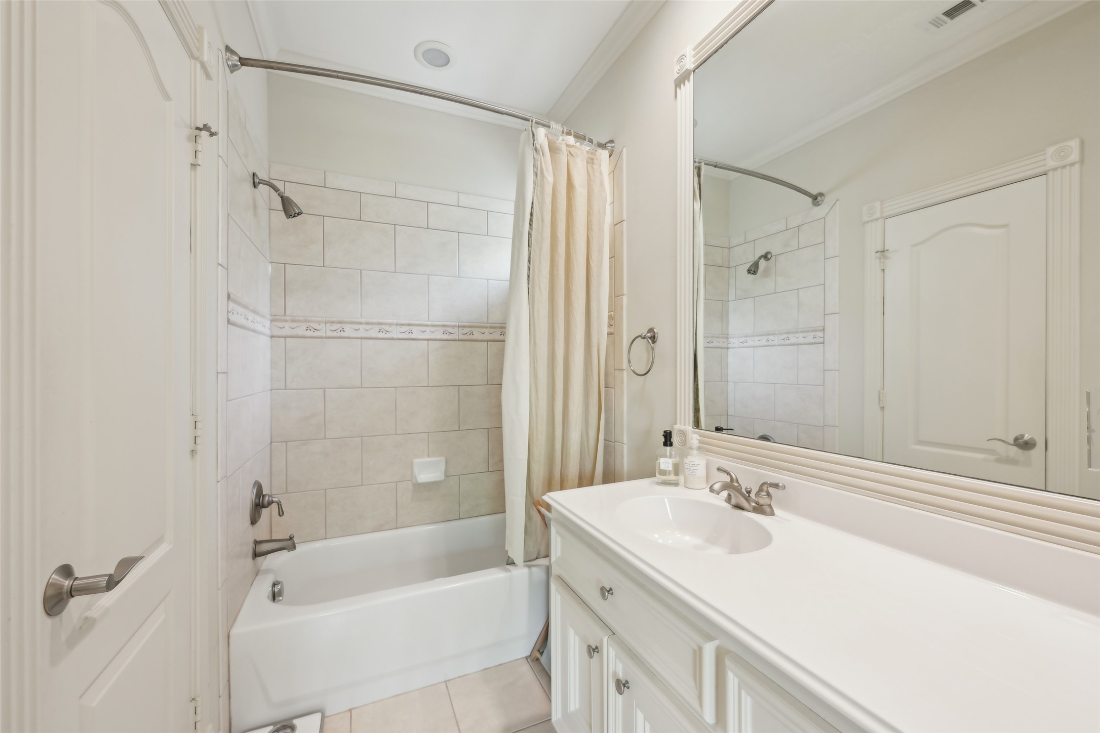 4026 Villanova Street Houston, TX 77005 - Photo 30 of 48 a bathroom with a sink double vanity granite tub shower and a mirror