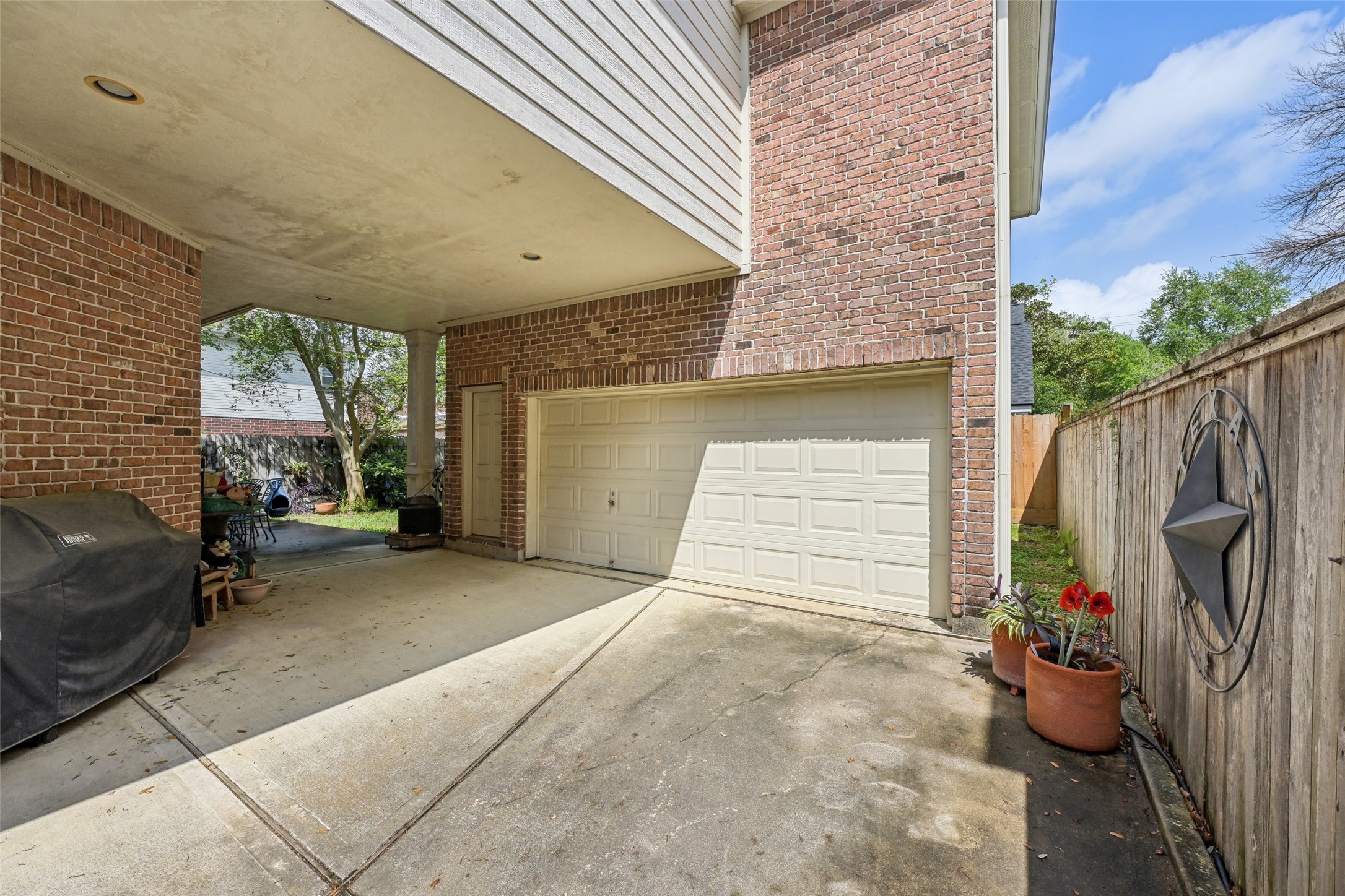 4026 Villanova Street Houston, TX 77005 - Photo 33 of 48 a view of a patio with couches and potted plants