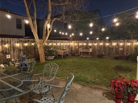 4026 Villanova Street Houston, TX 77005 - Photo 36 of 48 a view of a porch with a table and chairs