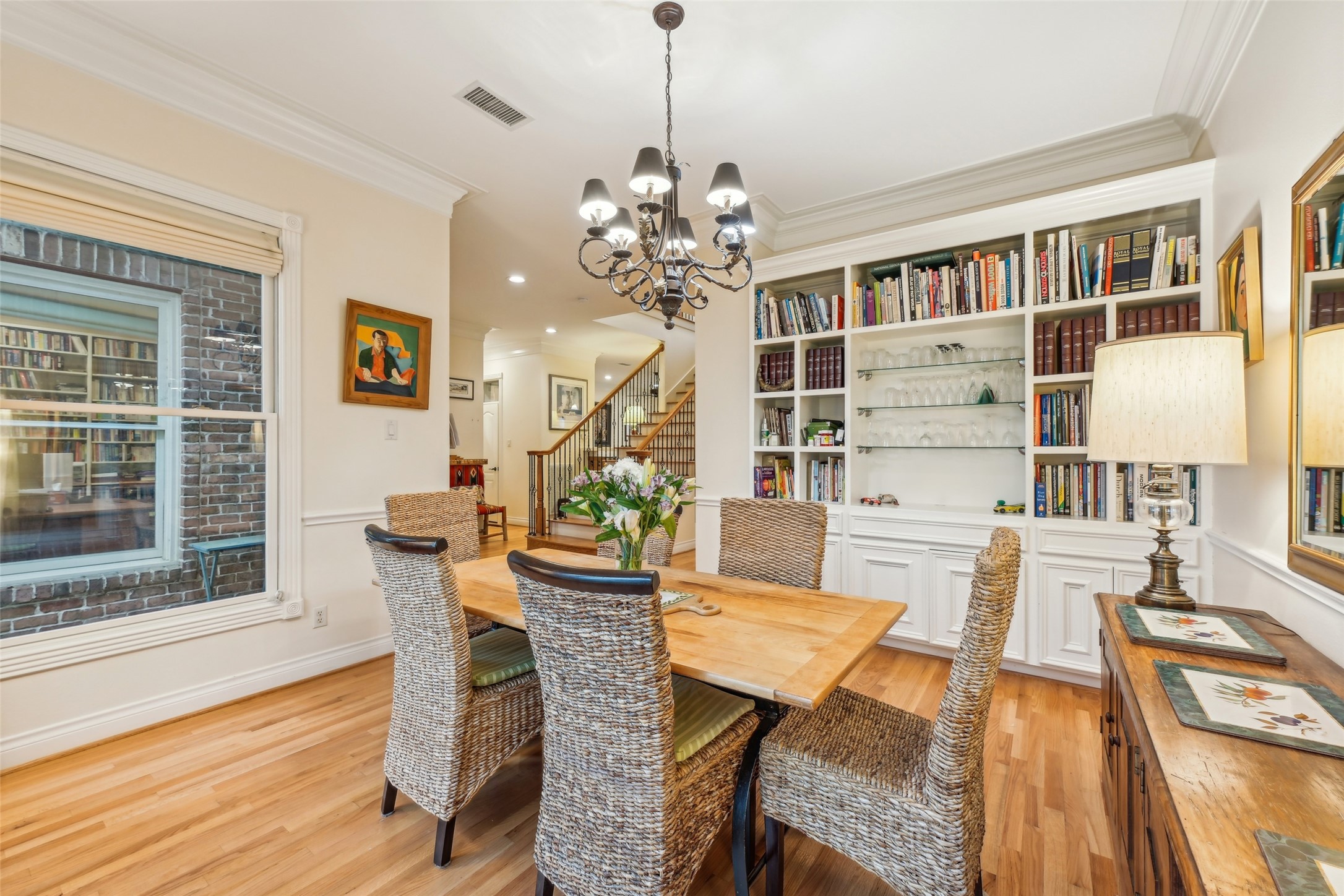 4026 Villanova Street Houston, TX 77005 - Photo 4 of 48 a view of a dining room with furniture and wooden floor
