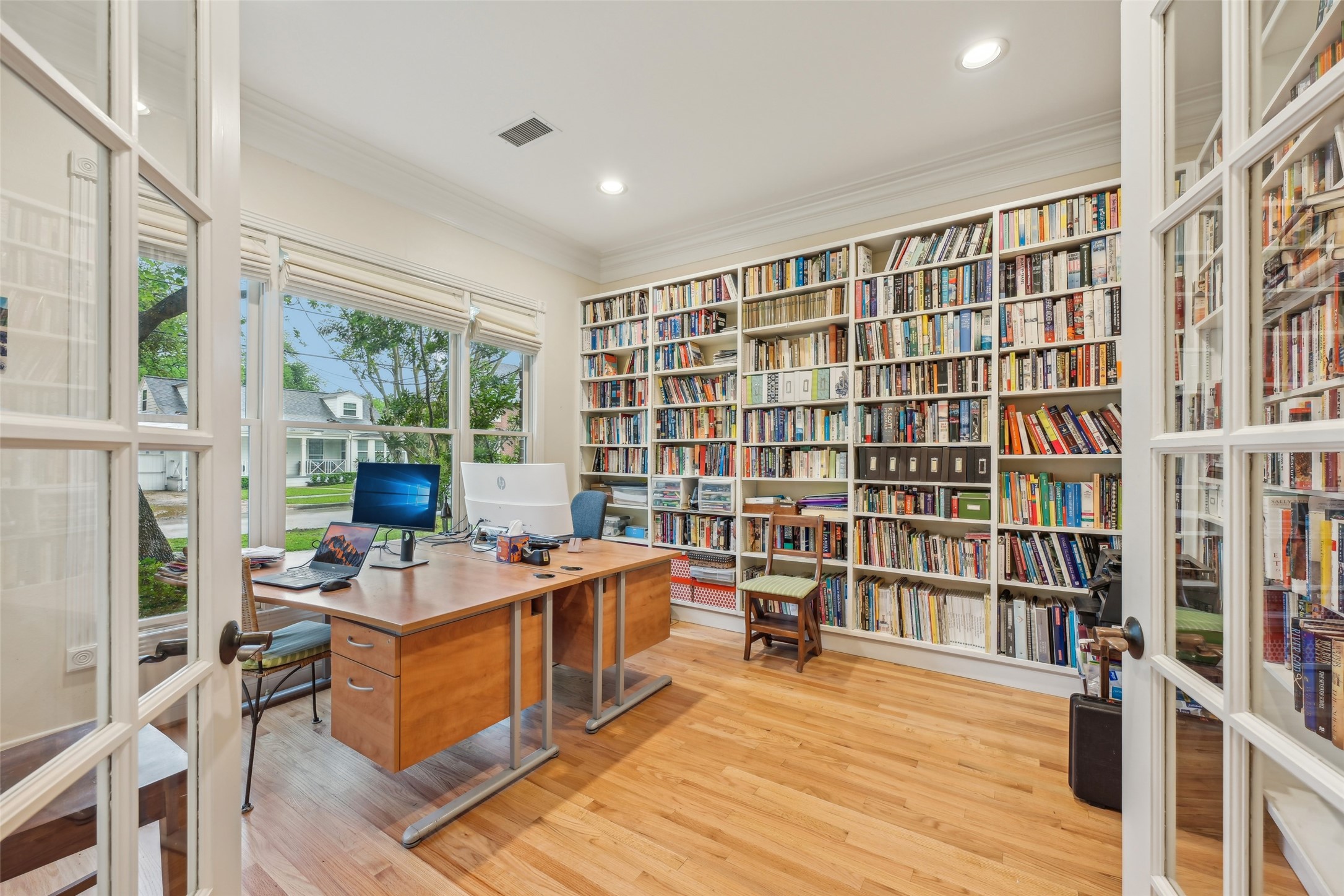 4026 Villanova Street Houston, TX 77005 - Photo 6 of 48 a room with furniture a rug and a book shelf
