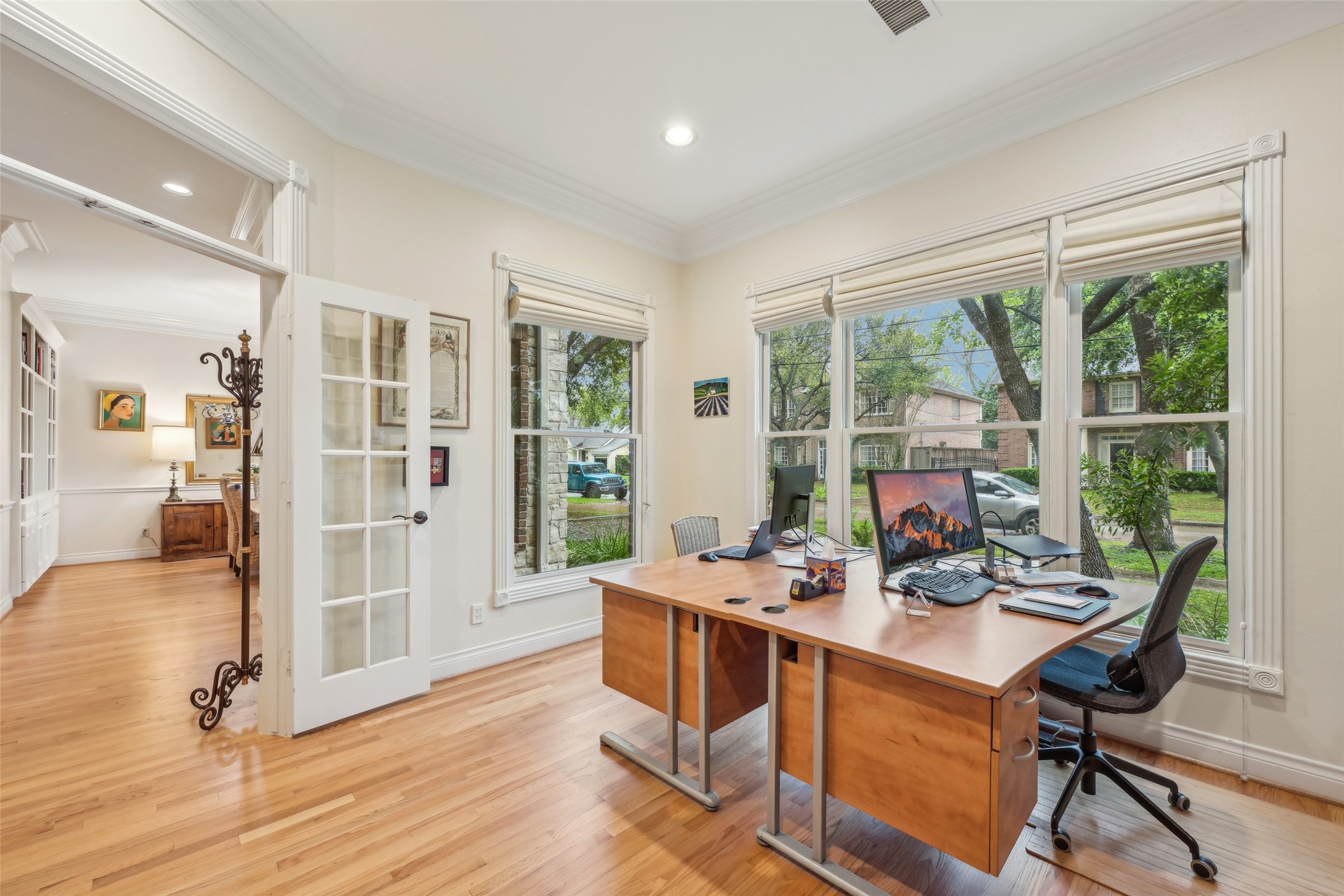4026 Villanova Street Houston, TX 77005 - Photo 7 of 48 a work room with wooden floor and furniture