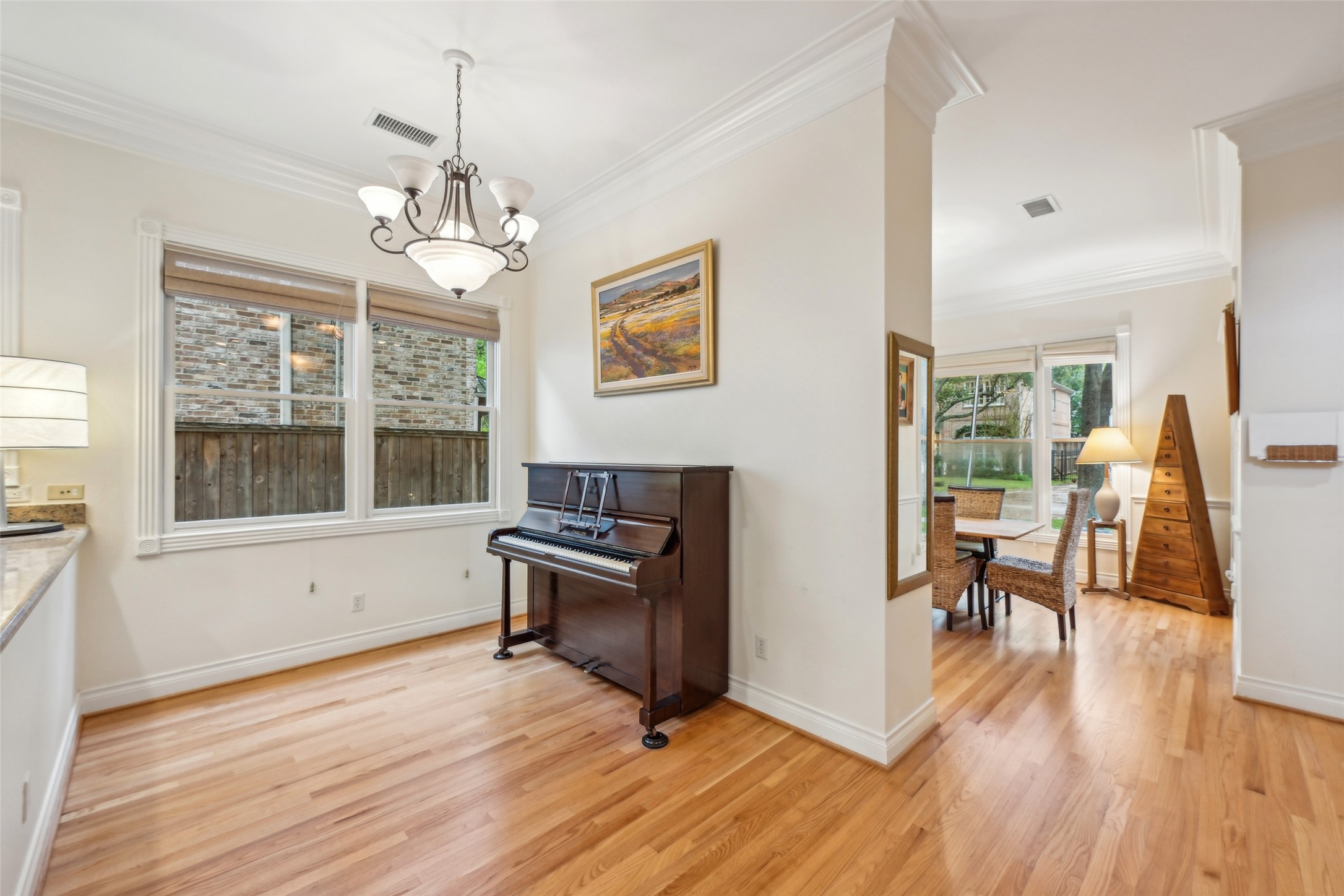 4026 Villanova Street Houston, TX 77005 - Photo 10 of 48 a view of a livingroom with furniture wooden floor and a window