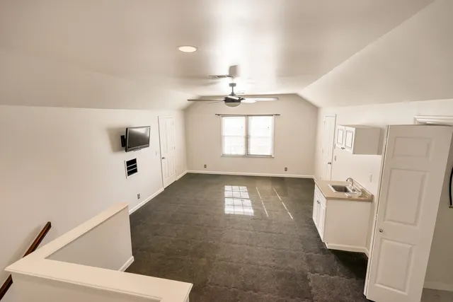 a view of a kitchen with a sink and cabinet