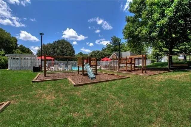 a view of a park with sitting area