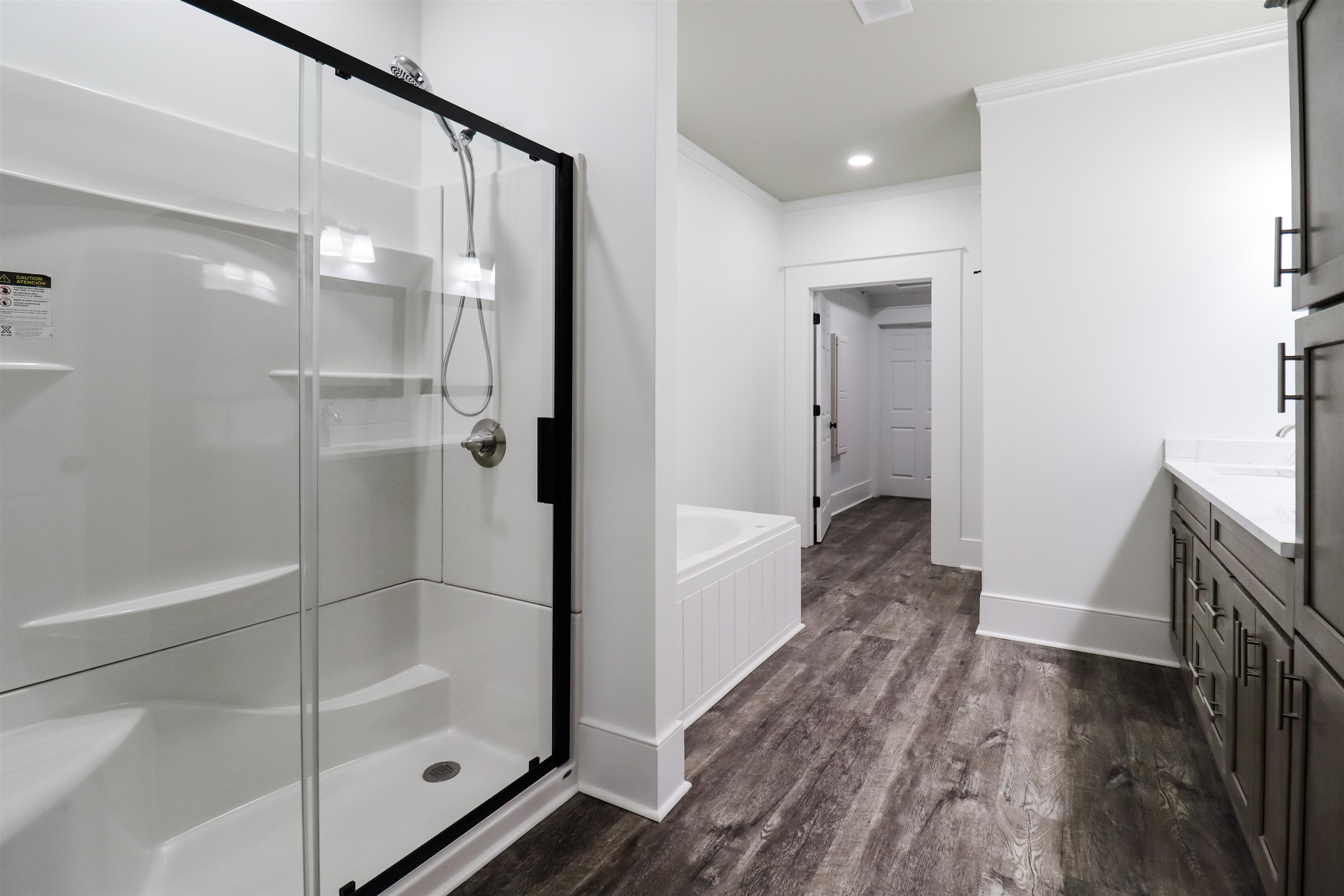 7237 Edith-Nankipoo Road Ripley, TN 38063 - Photo 17 of 31 a bathroom with a glass shower door a sink and a glass door shower
