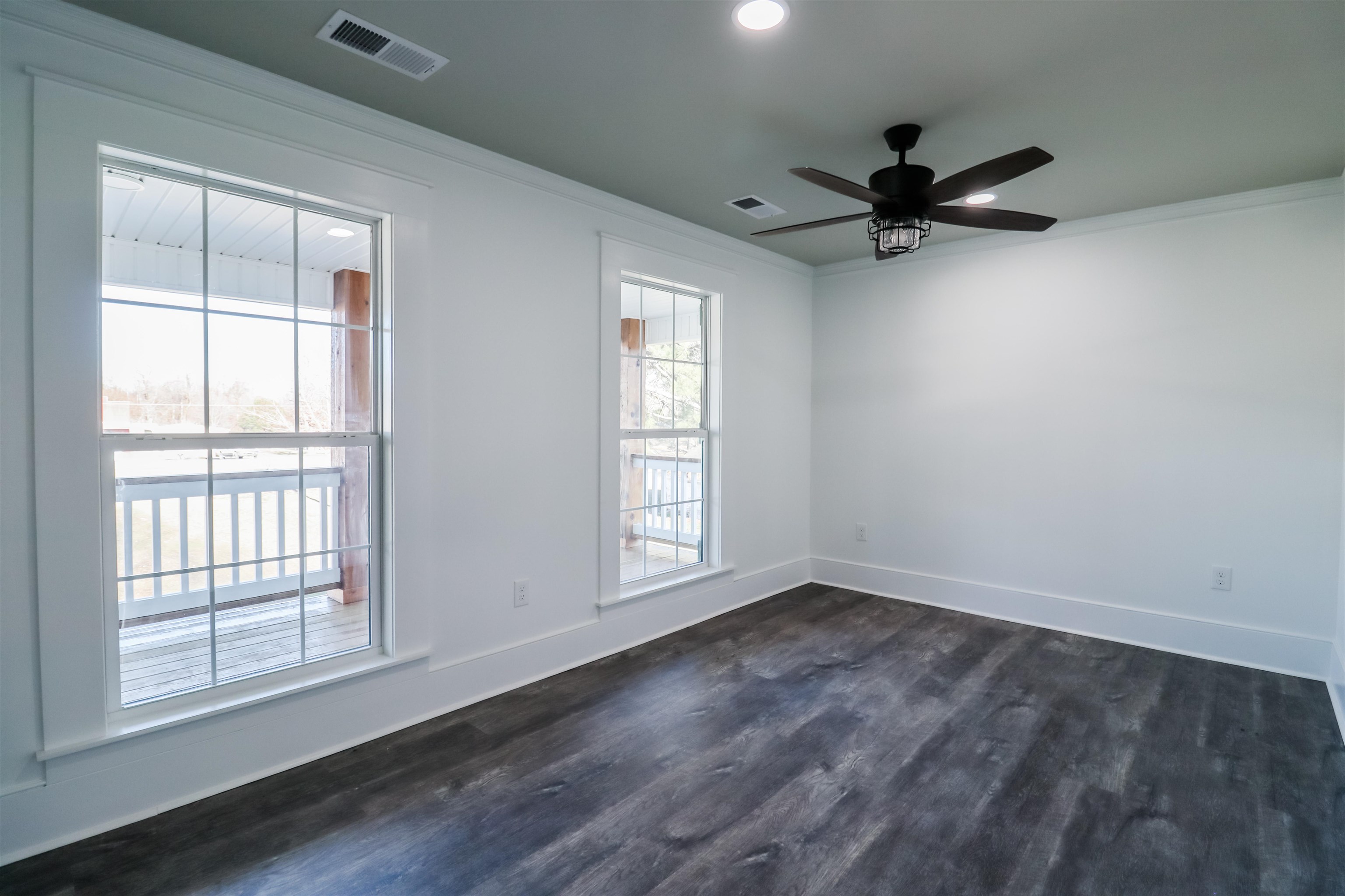 7237 Edith-Nankipoo Road Ripley, TN 38063 - Photo 19 of 31 an empty room with wooden floor fan and windows