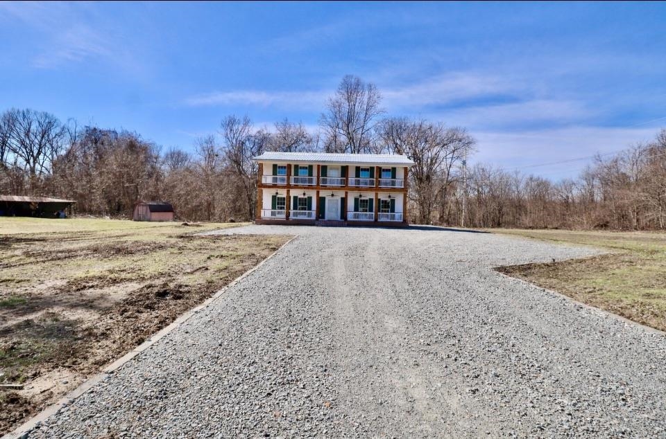 7237 Edith-Nankipoo Road Ripley, TN 38063 - Photo 2 of 31 View of front facade with driveway and a shed