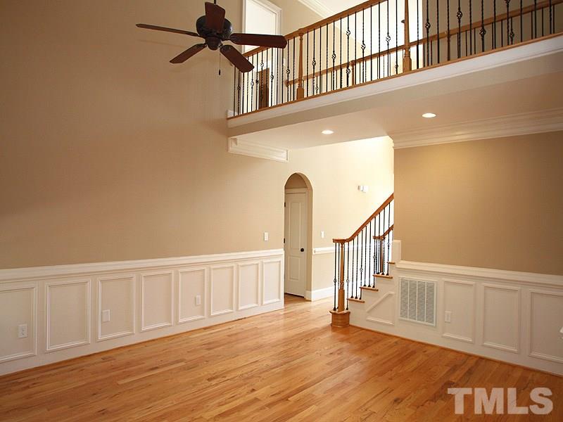 2317 Finley Ridge Lane Raleigh, NC 27615 - Photo 5 of 23 a view of staircase with white walls and a window