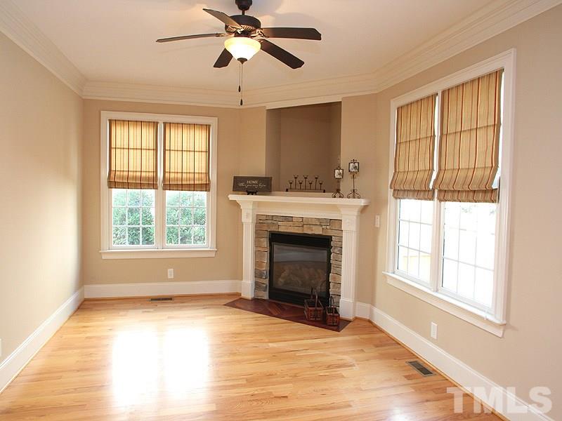 2317 Finley Ridge Lane Raleigh, NC 27615 - Photo 9 of 23 a view of an empty room with wooden floor and a window
