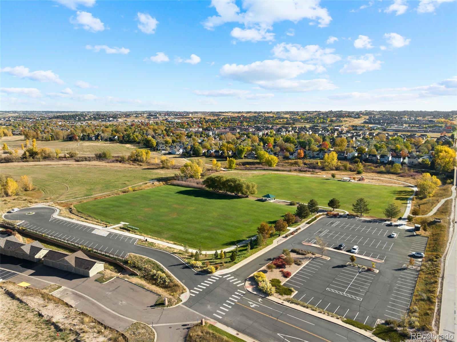 18633 Stroh Road, Unit 2103 Parker, CO 80134 - Photo 11 of 22 an aerial view of a houses with a lake view