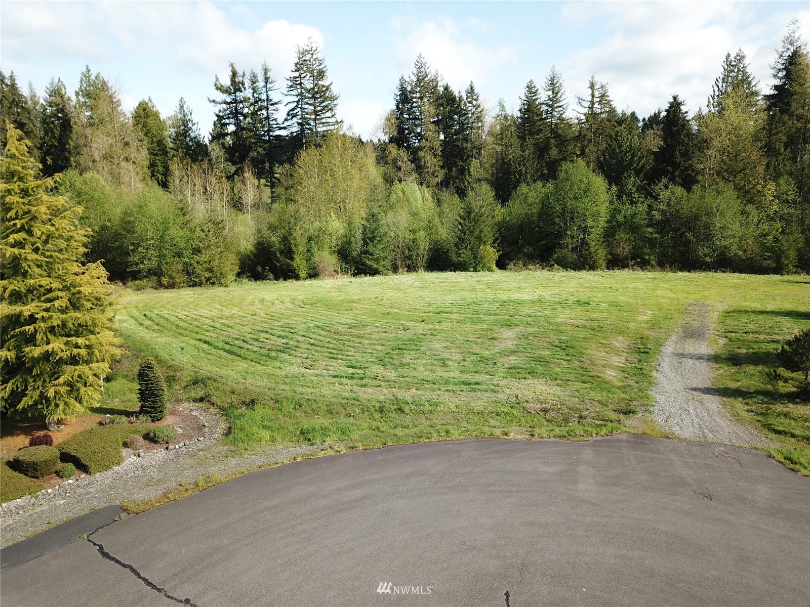 5825 139th Trail Southwest Rochester, WA 98579 - Photo 1 of 7 a big yard with lots of green space