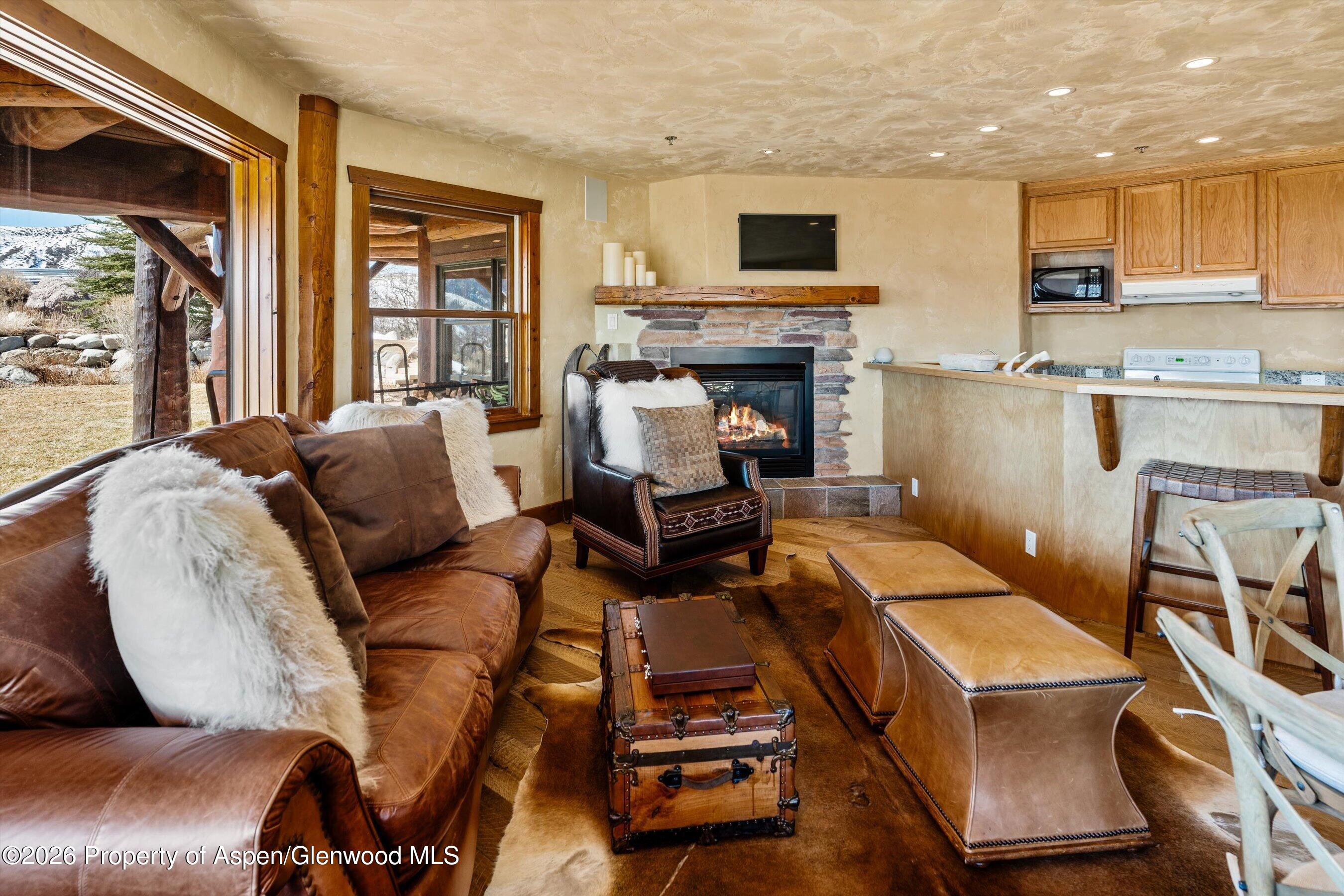 1450 Mesa Road Snowmass, CO 81654 - Photo 29 of 49 11ApartmentLivingAreaFireplace
