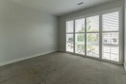 a view of an empty room with a large window
