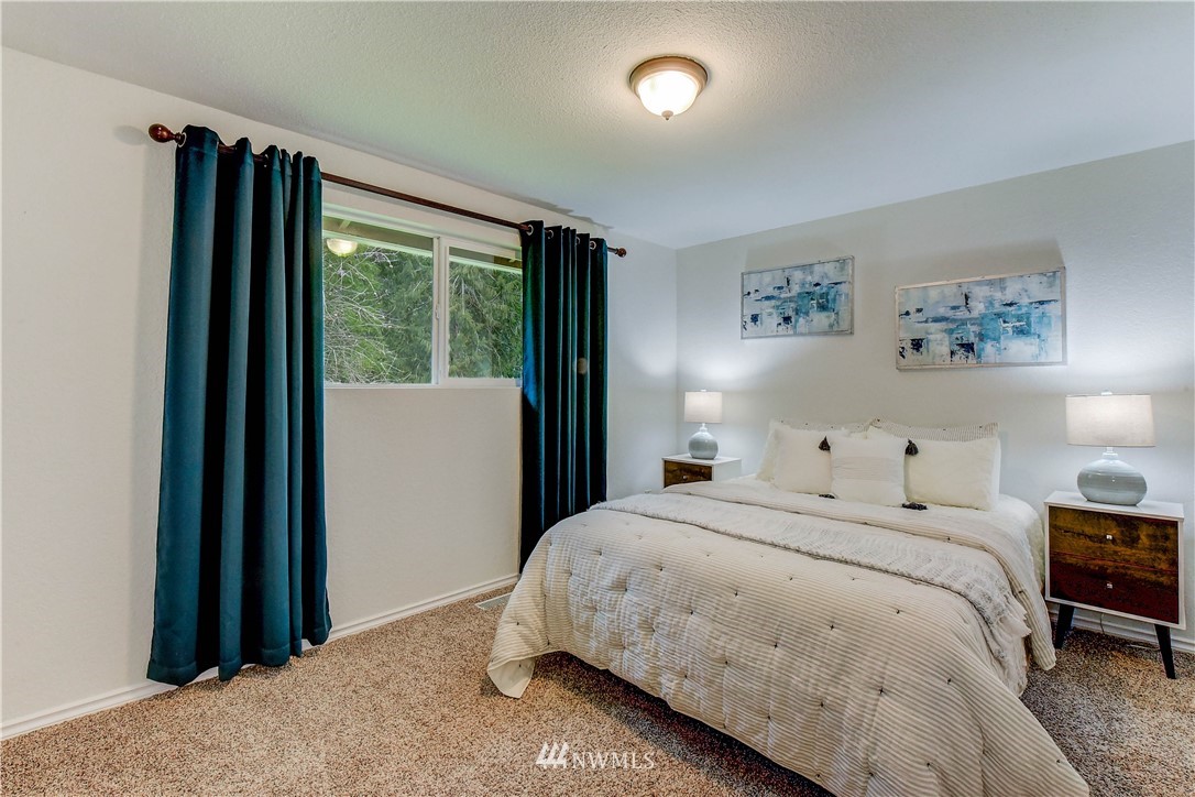 3327 Walsh Road Snohomish, WA 98290 - Photo 13 of 37 a bedroom with a bed and a large window
